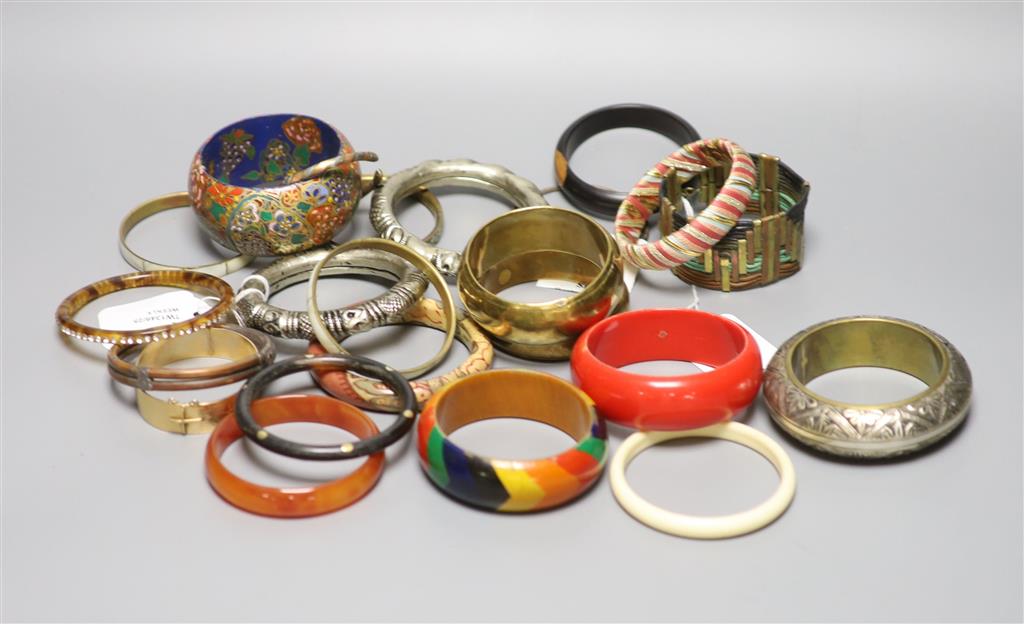 A collection of bangles, including five ethnic white metal examples,